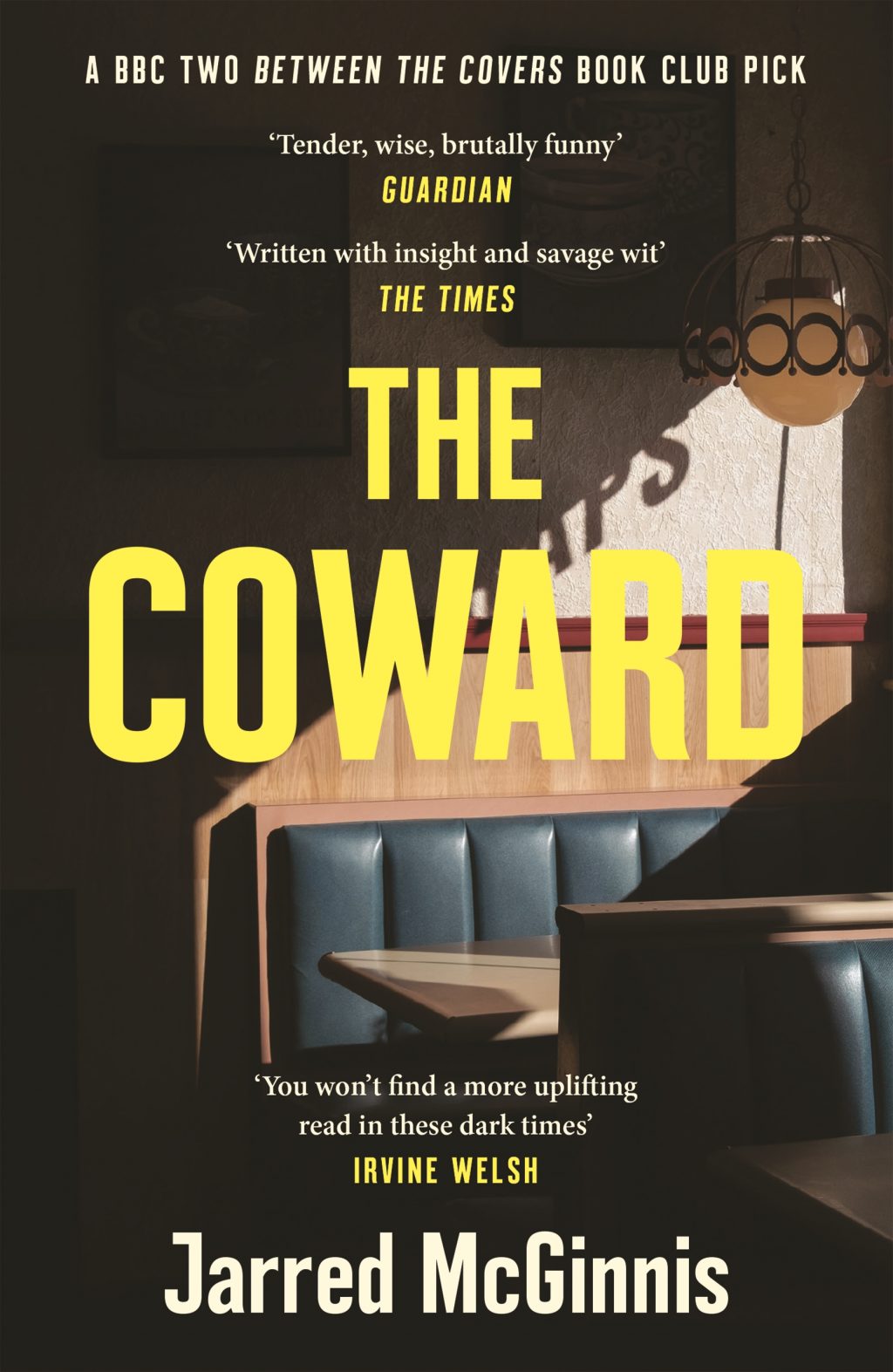 Paperback cover of the Coward by Jarred McGinnis showing a Hopper-esque diner booth